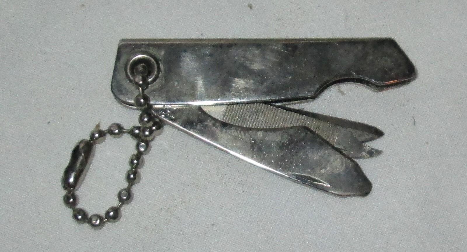 USED METAL KEYCHAIN BOTTLE OPENER KNIFE AND FILE