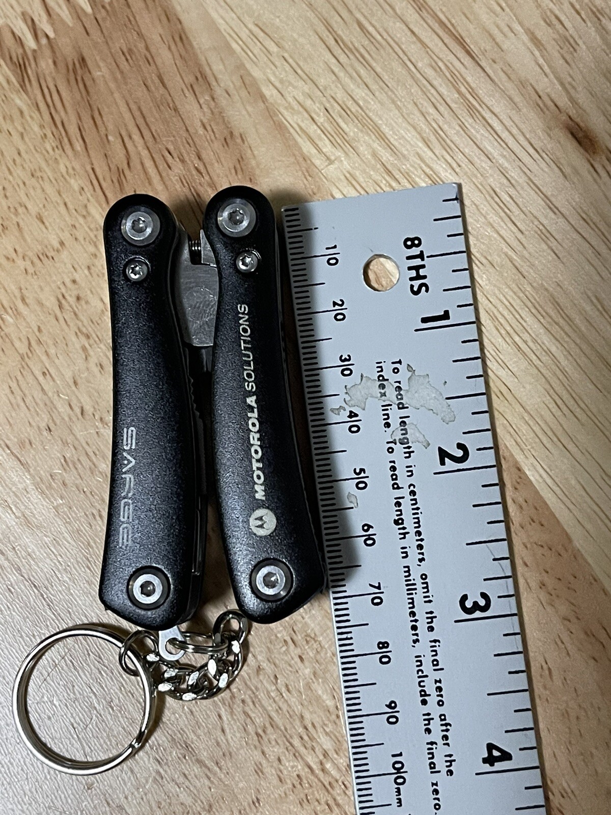 Sarge Mini 10 In 1 Black Zytel Stainless Steel Multi Tool Company Logo