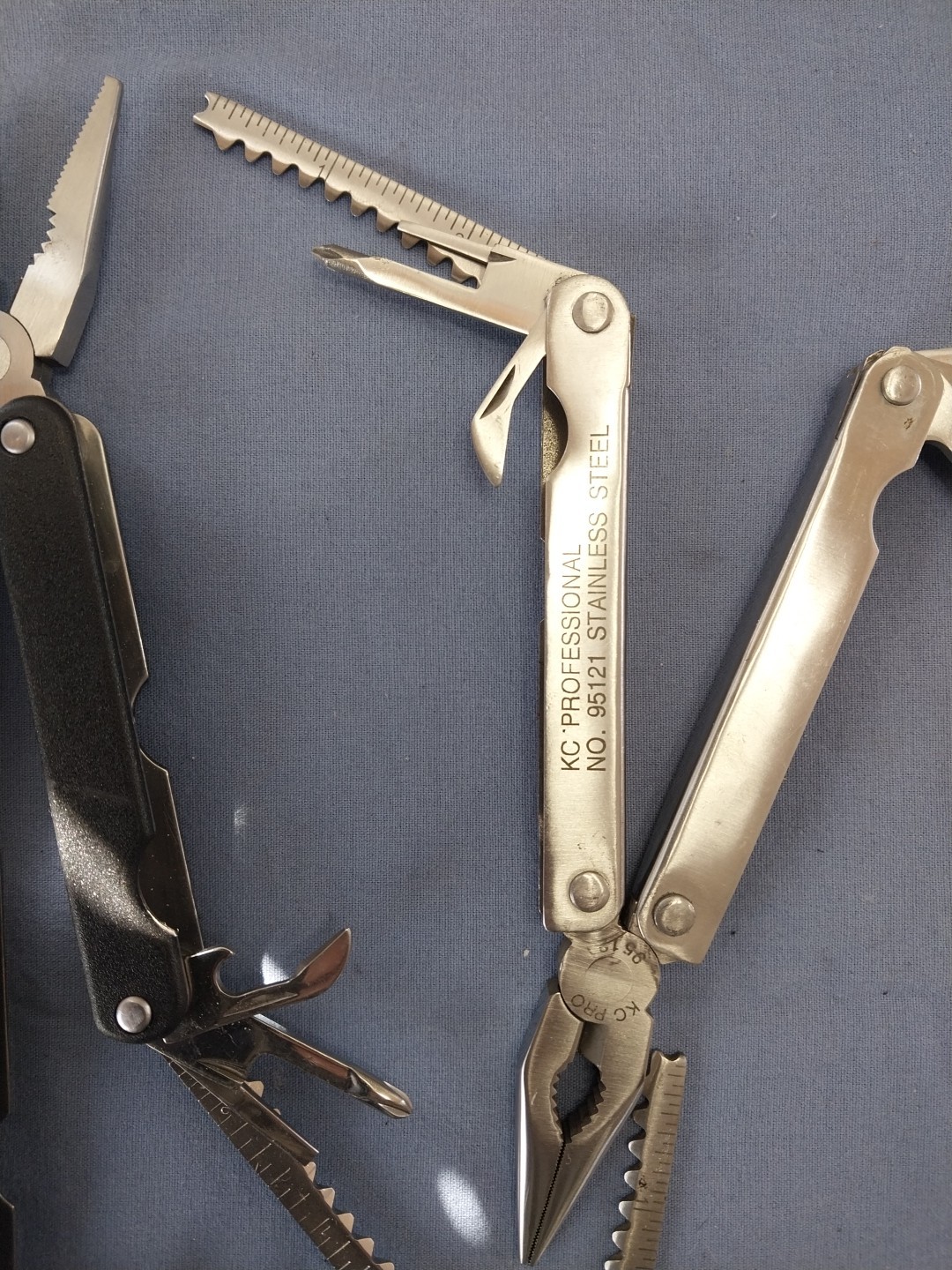 4 multi tools pliers screwdriver knife saw