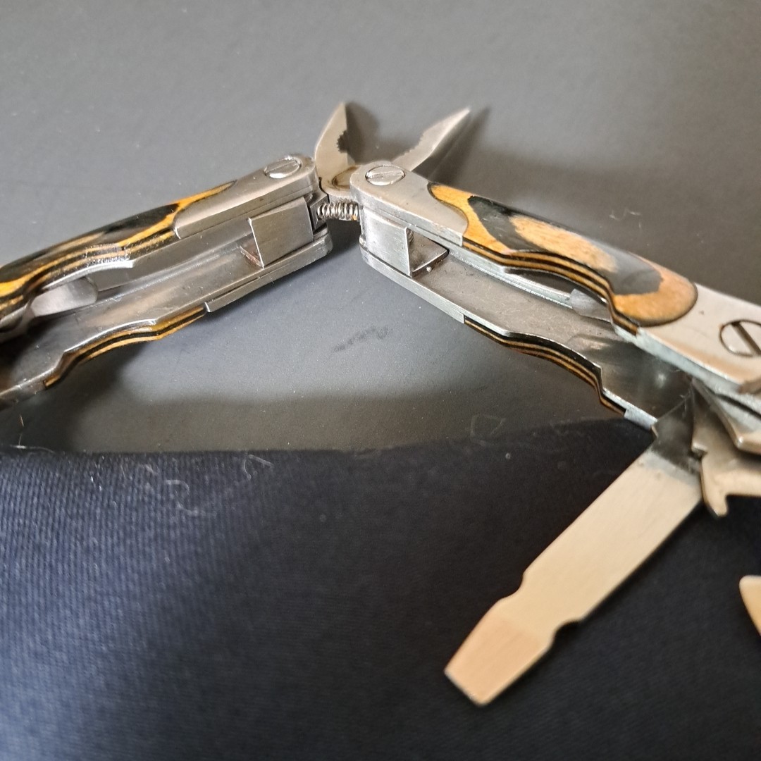 Multi tool With Laminated Wood Handles, Clean