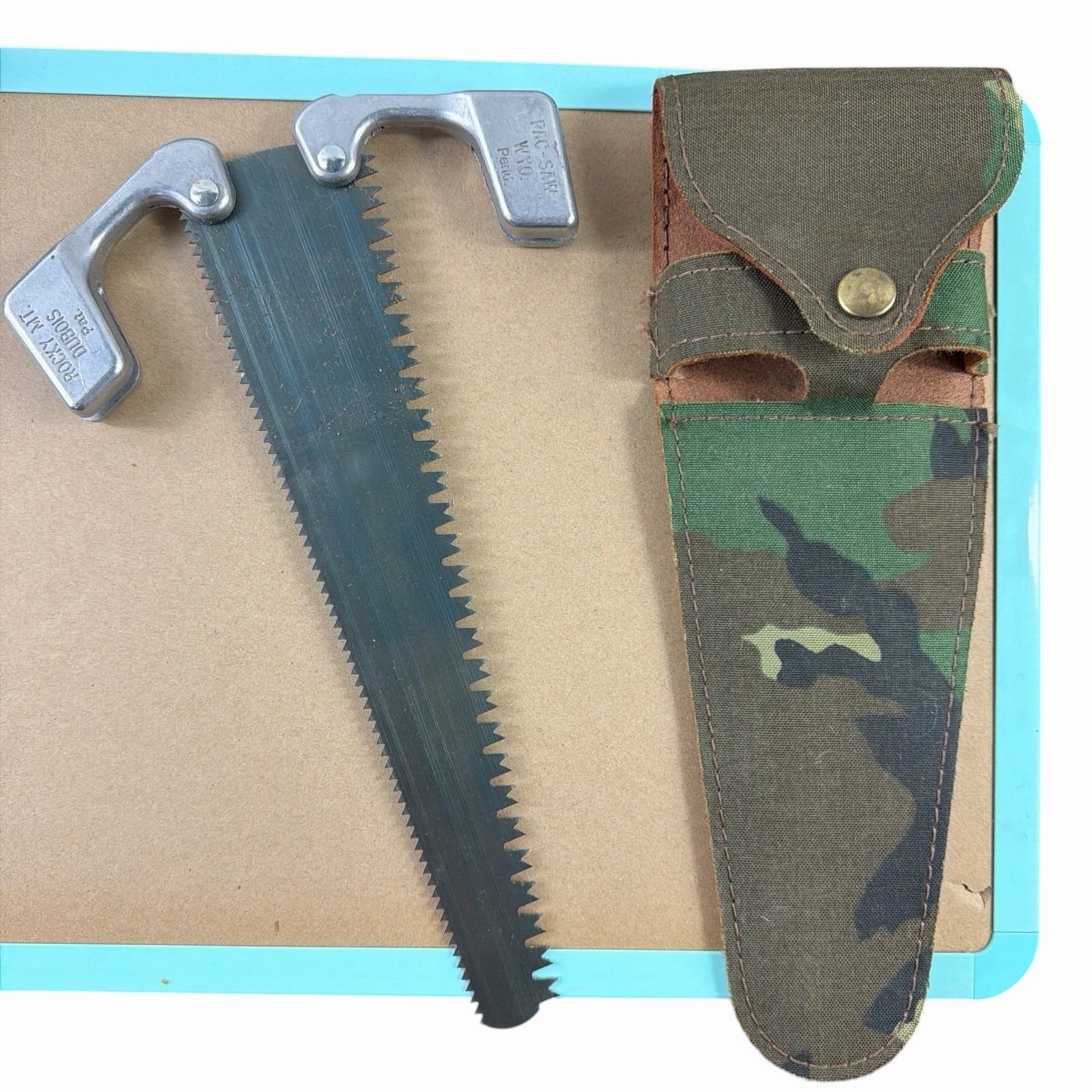 Rocky Mountain Pac Saw Dubois WYO. with Camo Sheath Camping Hunting GUC