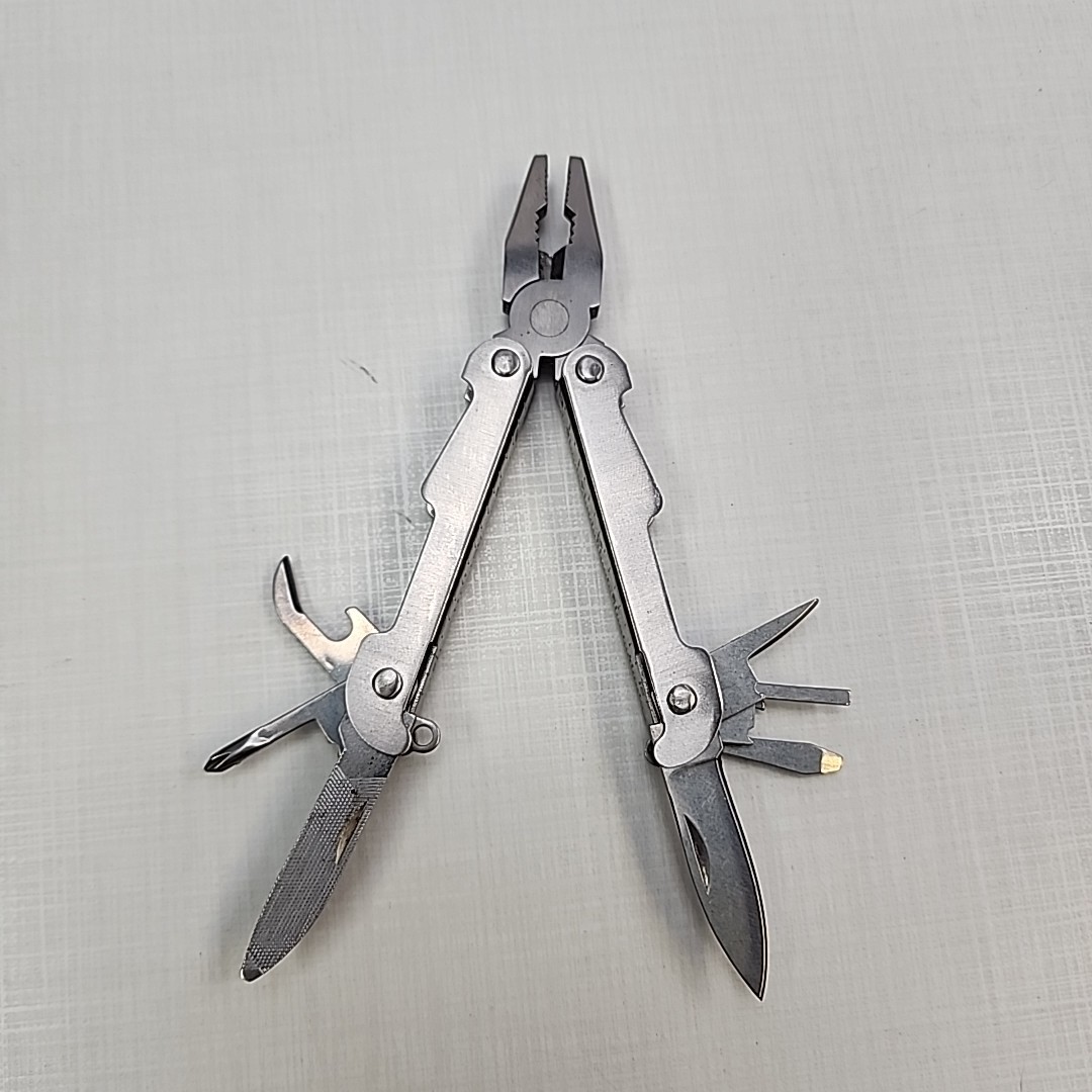 Pocket multi tool unbranded, plier, knife, file, screw drivers, awl, can opener
