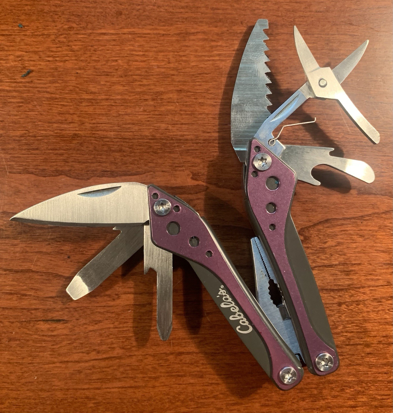 Cabela’s 8-Tool Multi-Tool with Spring Open Pliers, Scissors, Saw Purple