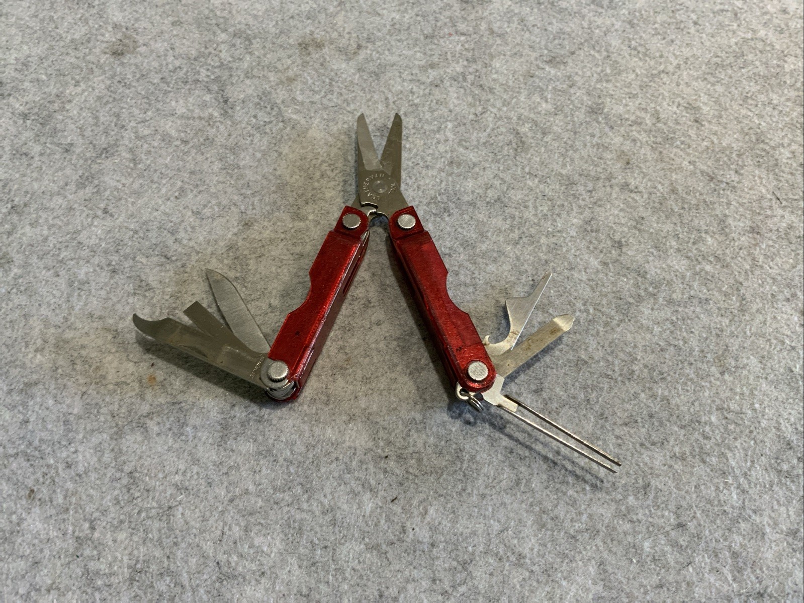 Leatherman Micra Multi Tool Red Transparent Plastic Coating Chipped