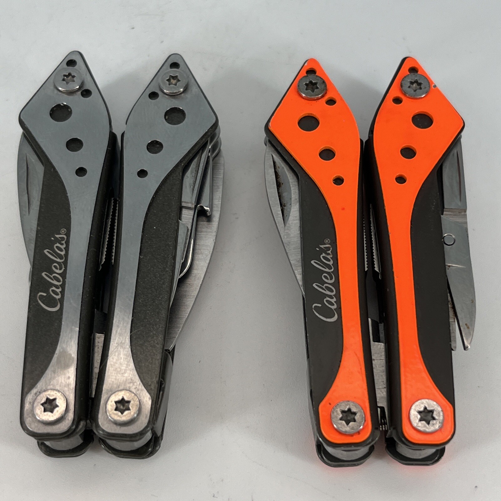 LOT OF 2 Cabela’s SILVER & ORANGE Mini MultiTool Spring Open Pliers Scissors Saw