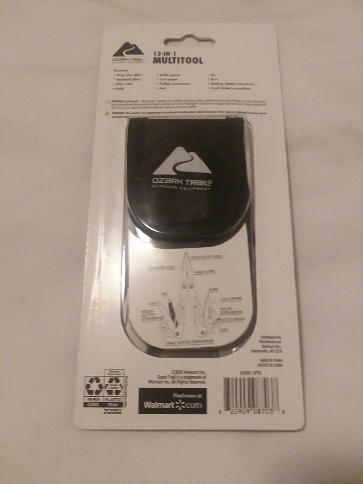 Ozark Trail 12-in-1 Multi Tool with Nylon Black Sheath. Silver handle.