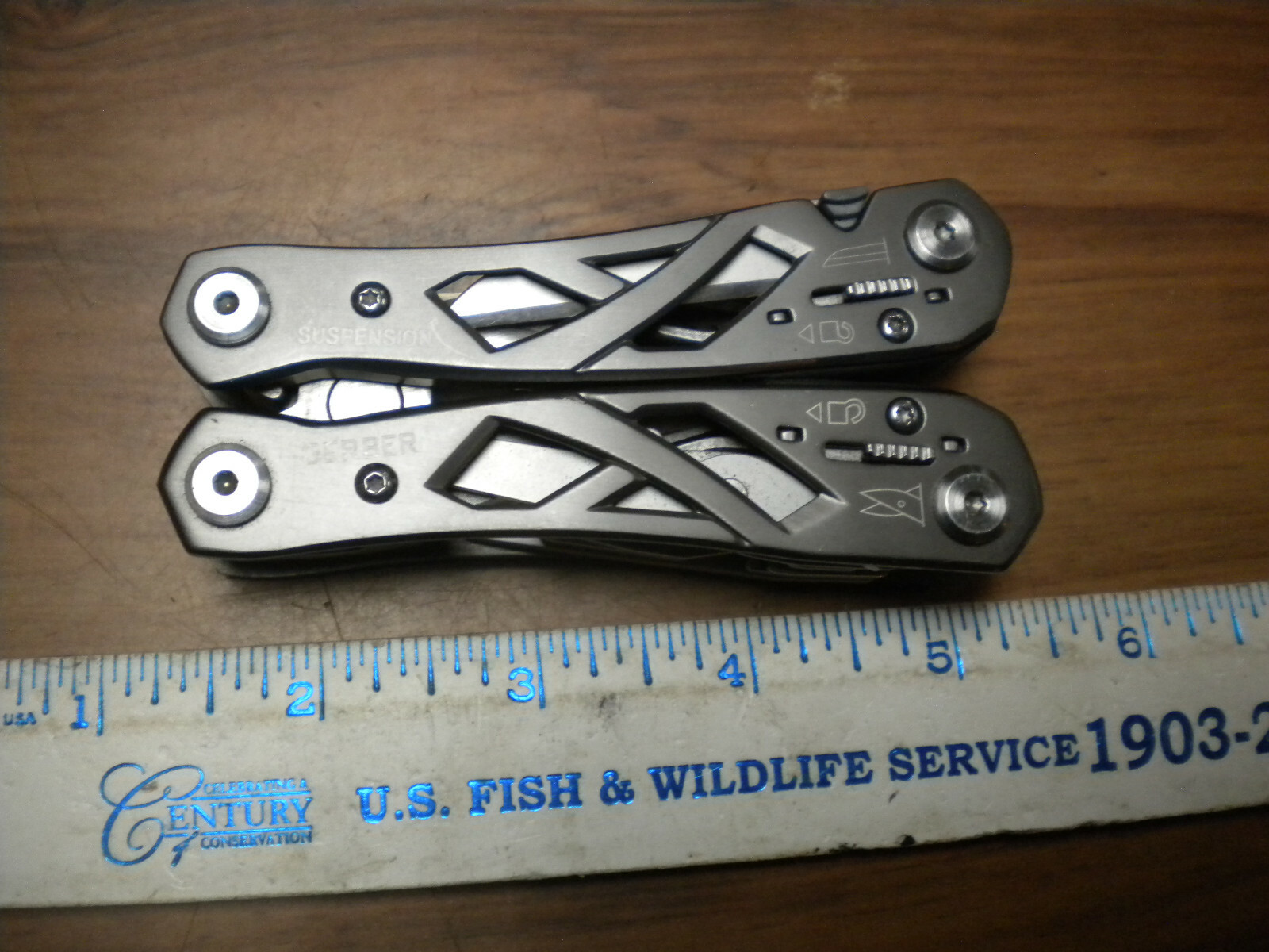 Gerber Suspension Multi-Tool with black nylon belt sheath in used excellent con