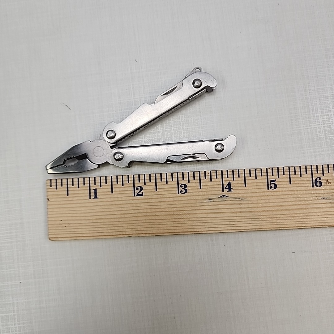 Pocket multi tool unbranded, plier, knife, file, screw drivers, awl, can opener