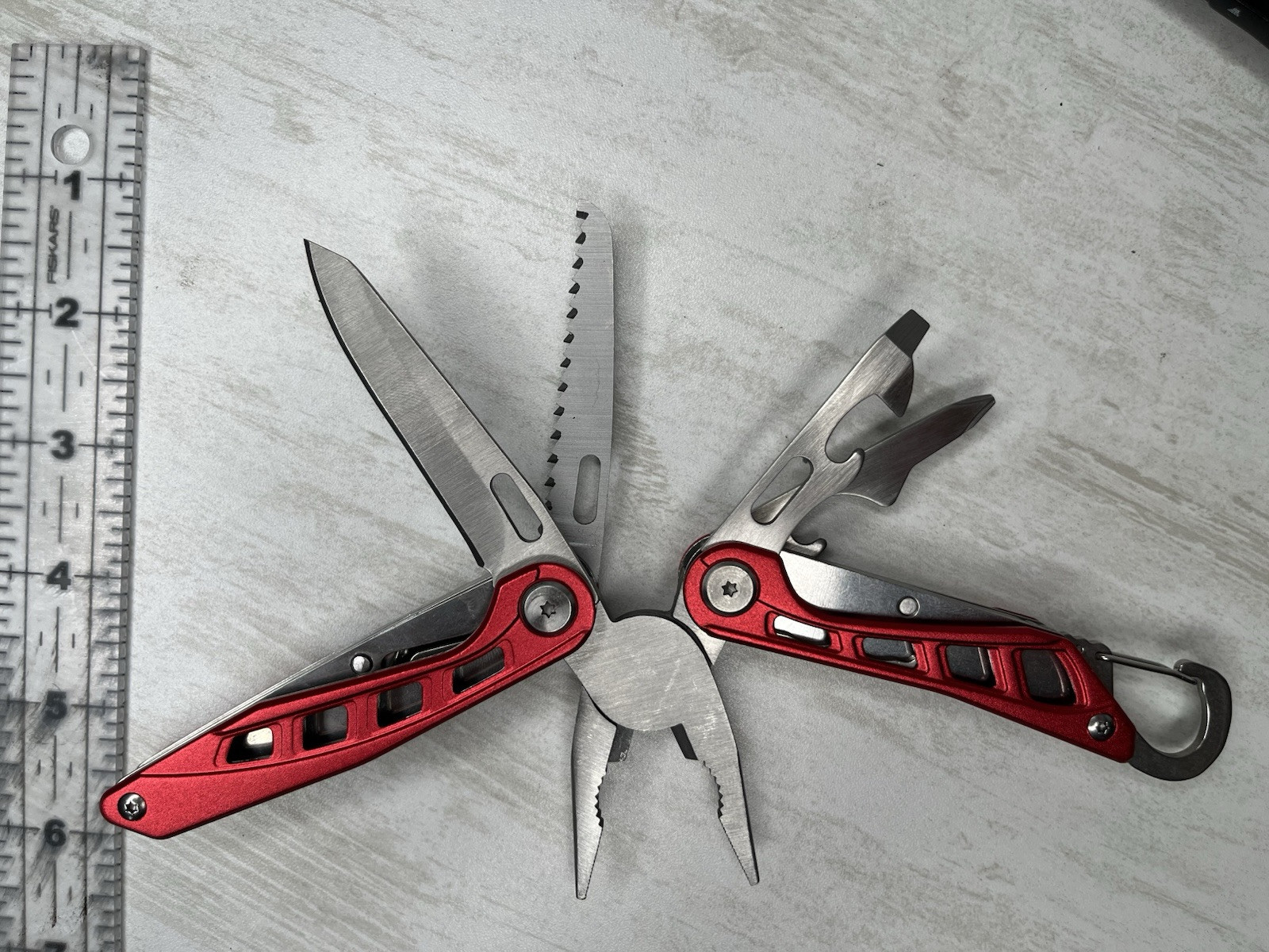 Basics 10-in-1 Stainless Steel Multitool Safety Lock with Nylon Sheath Red