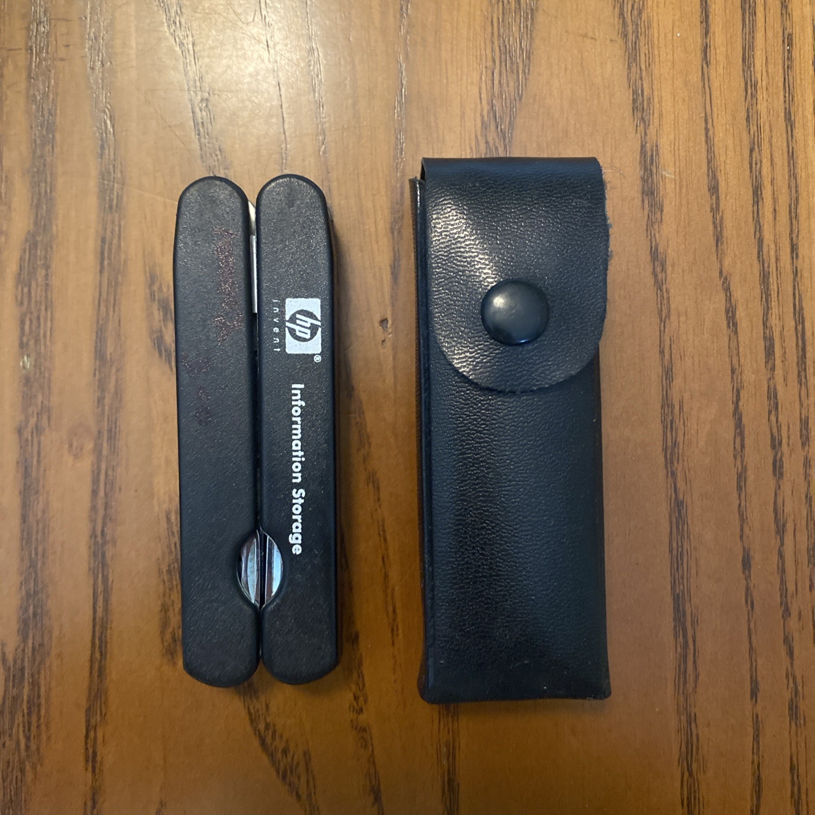 HP Black Multi Tool With 8 Attachments, Pliers, And Leather Sheath