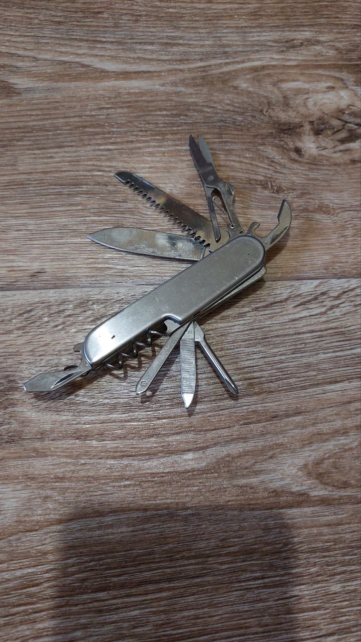 Tourist multitool knife 10 in 1, knife, corkscrew, screwdriver, scissors. Sochi