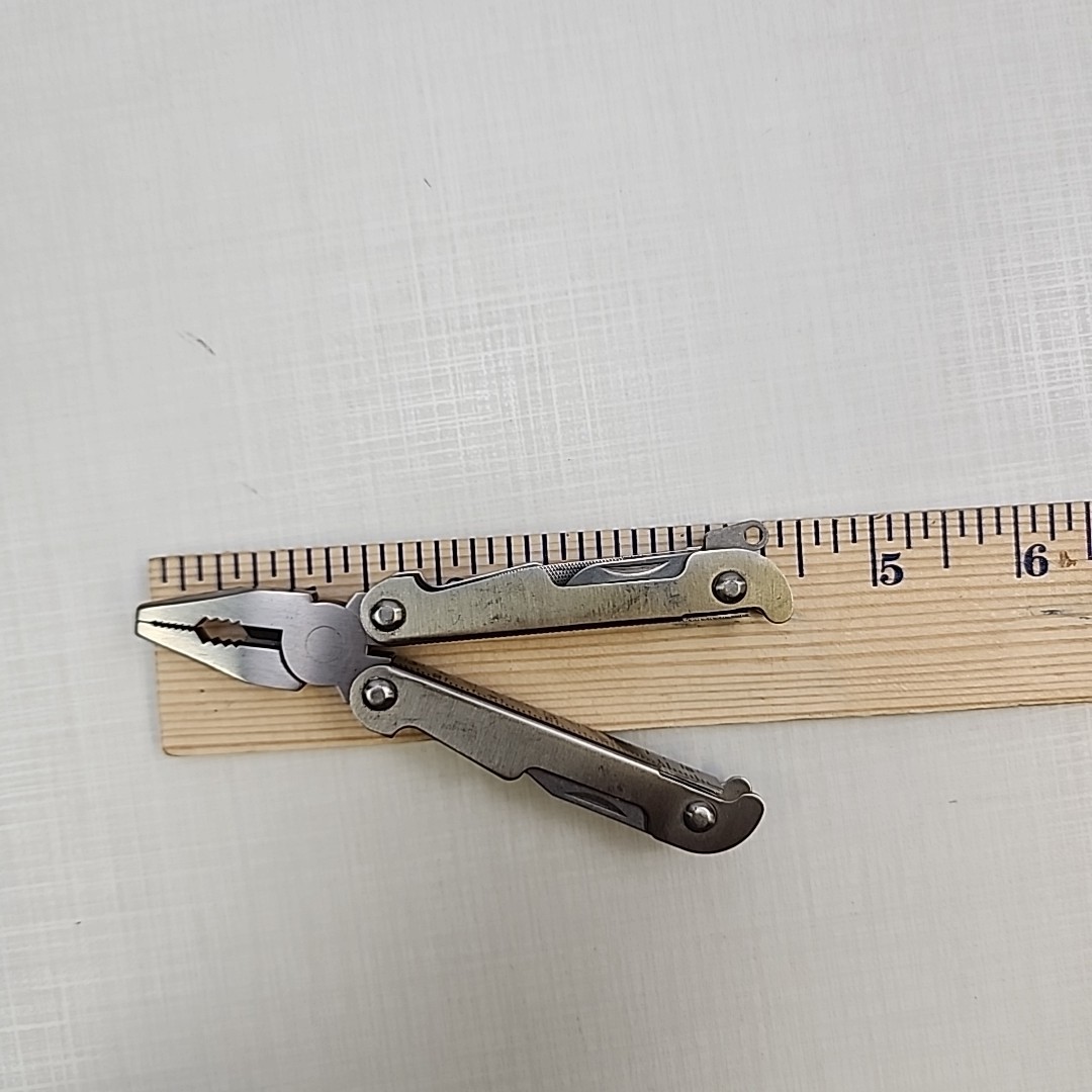 Pocket multi tool unbranded, plier, knife, file, screw drivers, awl, can opener