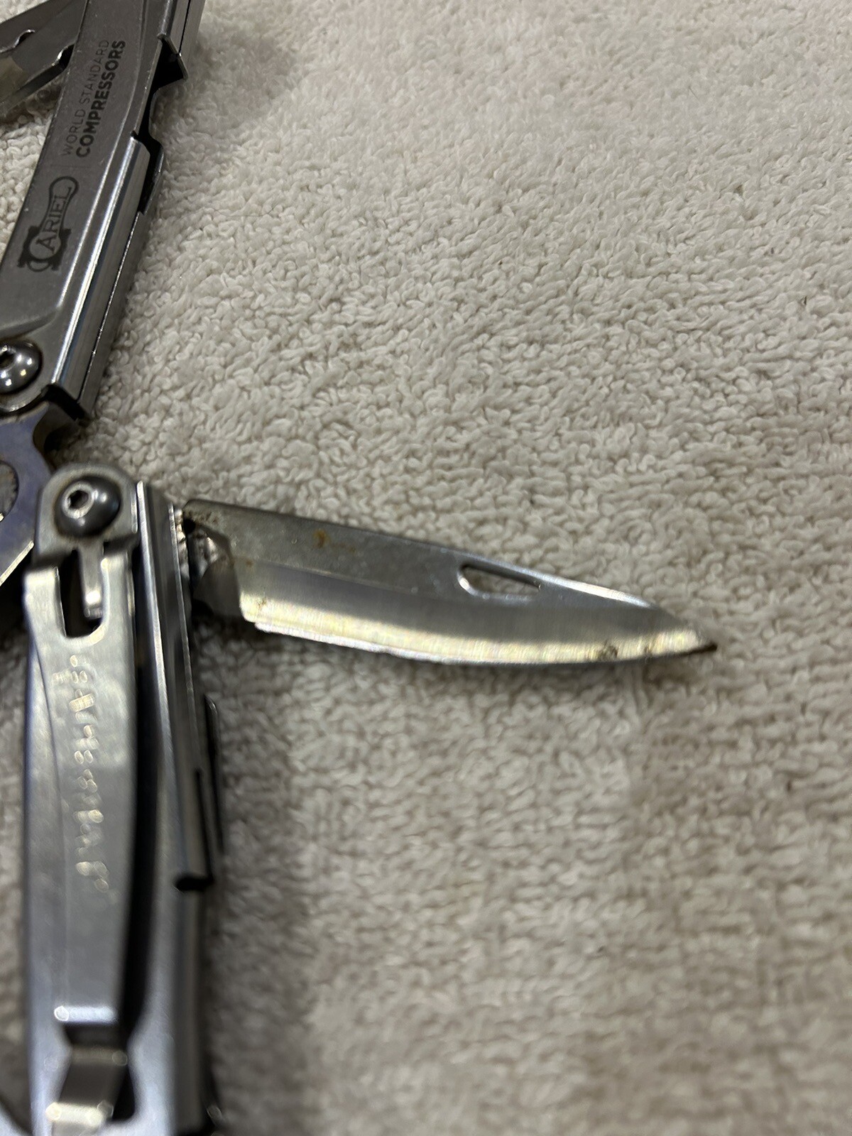 Leatherman Rev multitool with company logo