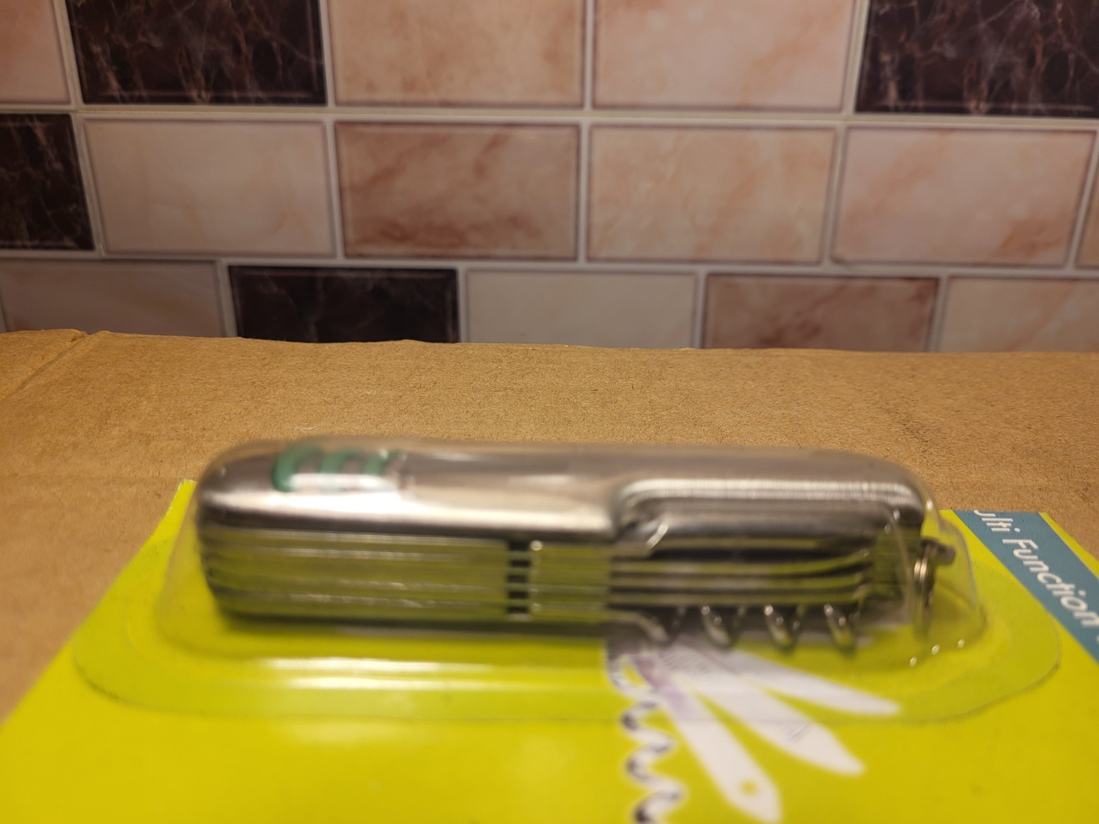 Multi Function Pocket Knife New/Sealed Multitool Silver W/Green Accents 3.5″