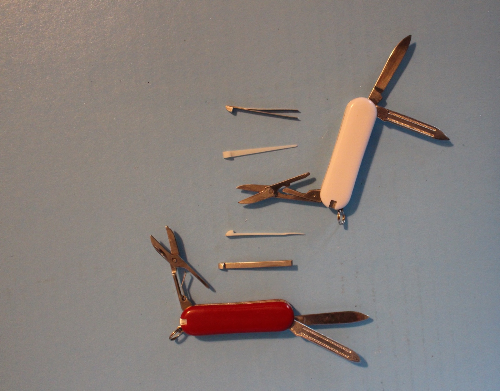 2 MULTI PURPOSE KNIFE LOT CAMPING HUNTING MULTI TOOL ONE RED ONE WHITE LOGO