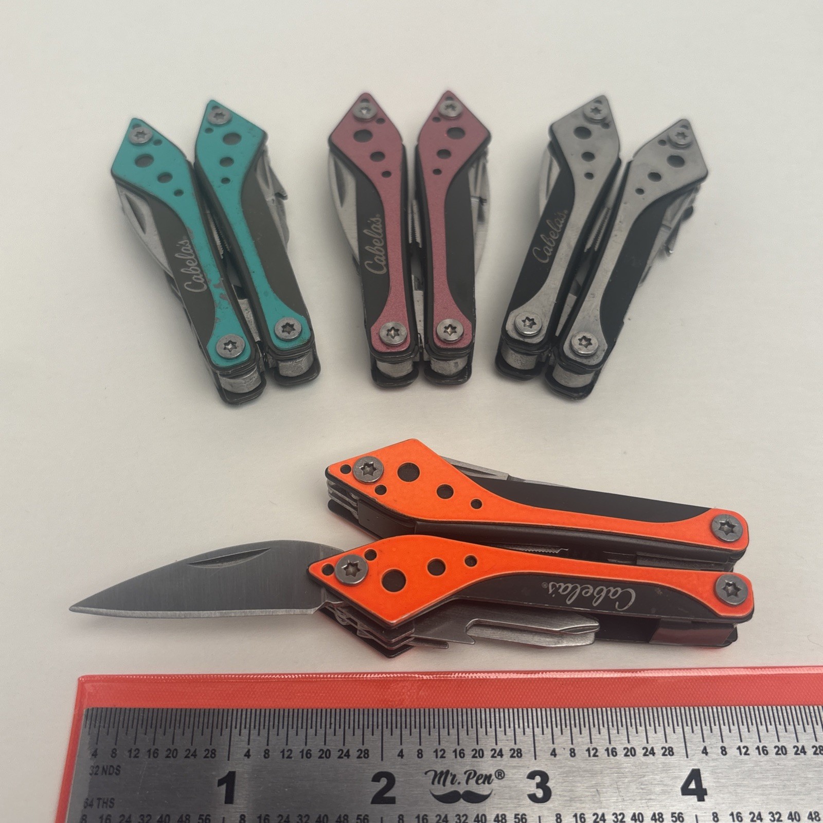 Cabela’s LOT of 4 Orange Teal Silver Pink Small Multi-Tool Camp Hike Hunt Fish