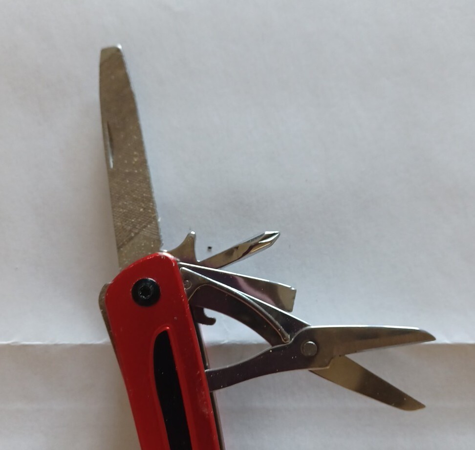 USED Craftsman 10 in 1 Multi Tool Pocket Knife Screwdriver Saw Bottle Opener RED