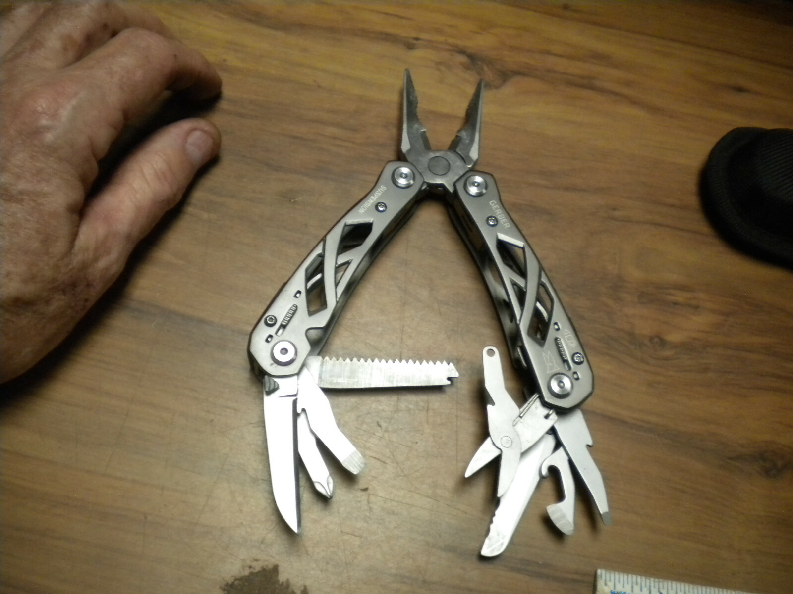 Gerber Suspension Multi-Tool with black nylon belt sheath in used excellent con