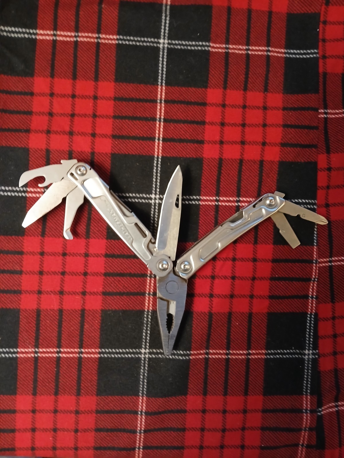 Leatherman Rev Multi-Tool with MO Welded on the surface