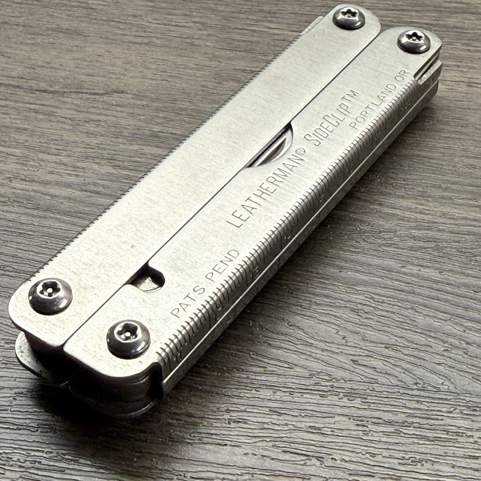 Leatherman Sideclip multitool. Lightly used. Late Run: shiny factory polished