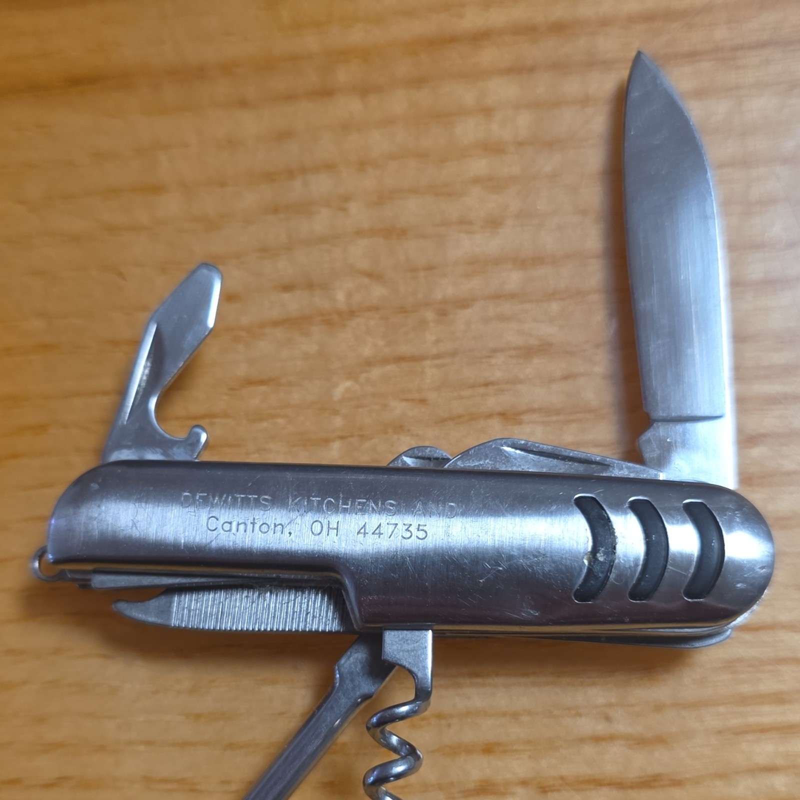 Silver Stainless Steel Multi-Tool, 5 Functions: Knife, Bottle Opener, Can Opener