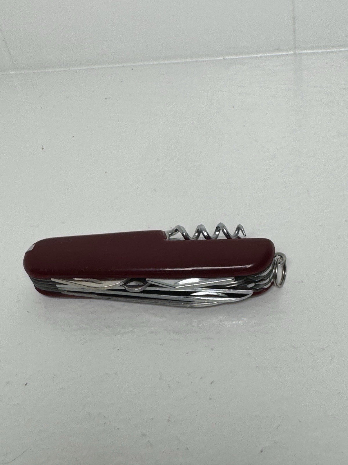 Red Swiss Army Knife With 12 Attachments Including Scissors, Saw, Etc