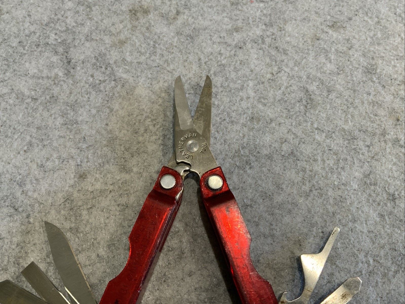 Leatherman Micra Multi Tool Red Transparent Plastic Coating Chipped