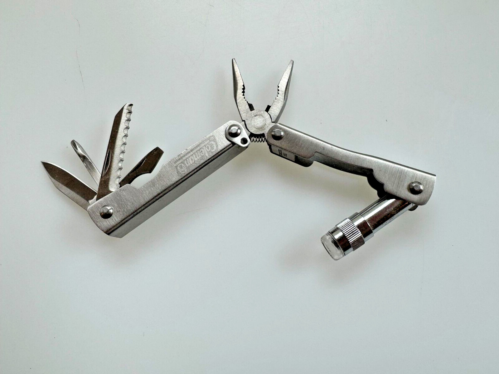 Lot of 6 Multi Tools (branded Coleman, etc.), Good Condition