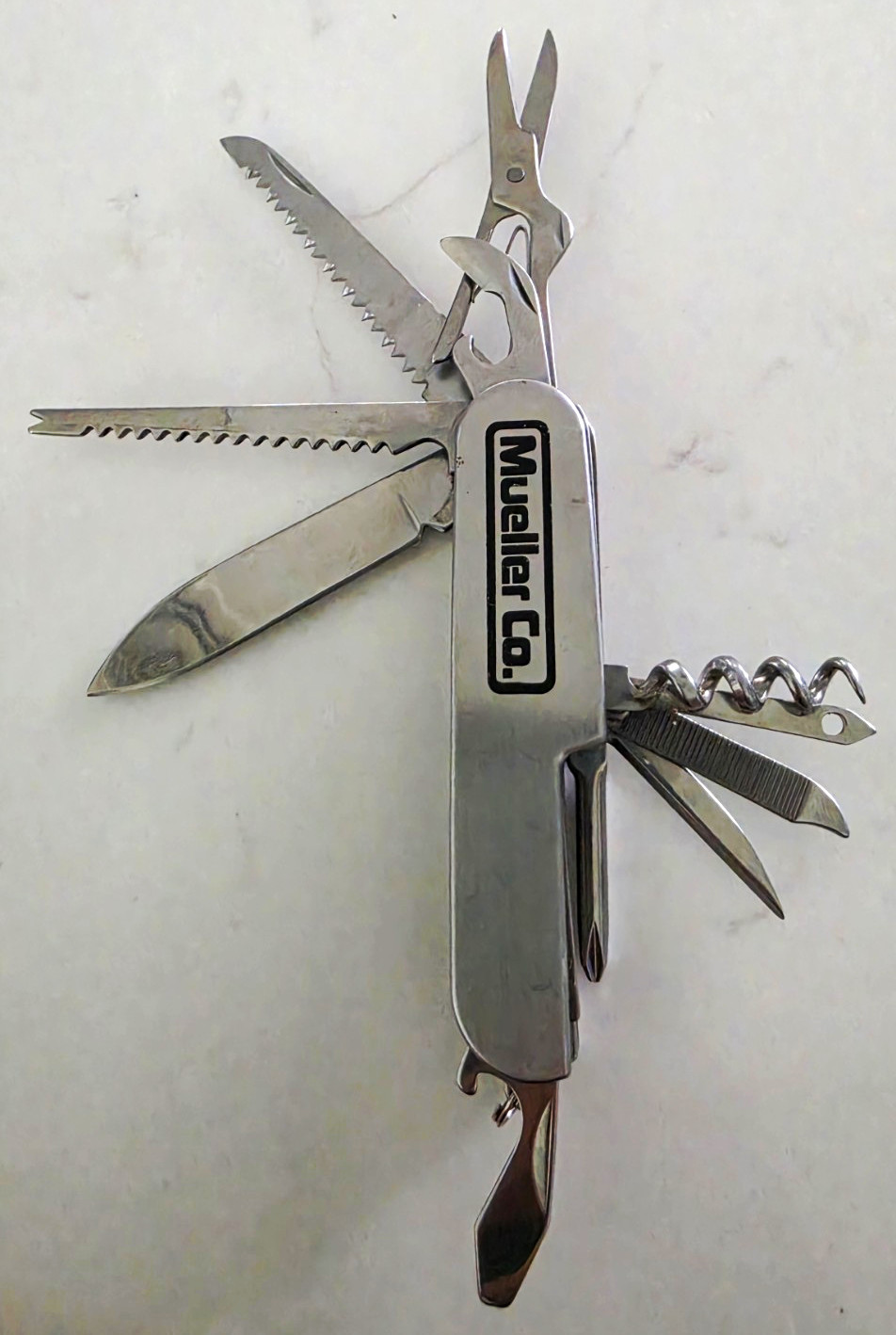 Mueller Co. Stainless Steel 12-in-1 Multi-Tool Knife Saw Scissors 2″ Blade