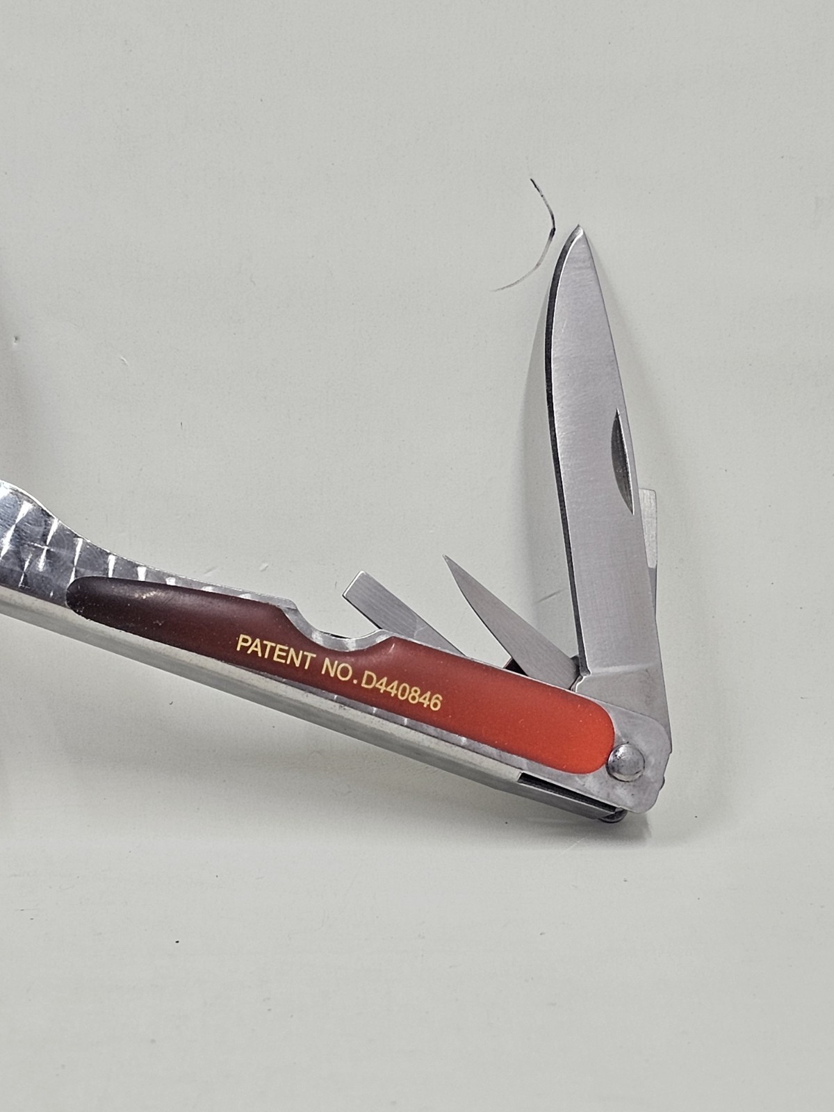 Sheffield No 1200E Stainless Steel Multi Tool Pliers Saw Knife Red Handle 4in