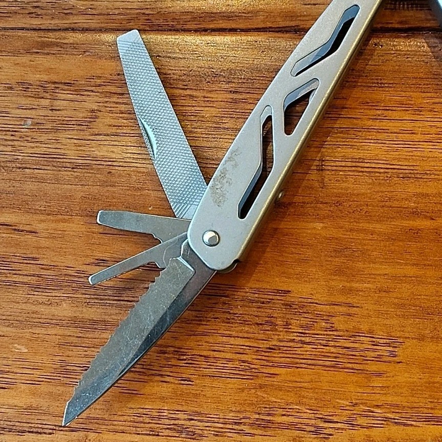 Ozark Trail 12-in-1 Multi Tool Silver Folding Pliers with Belt Sheath