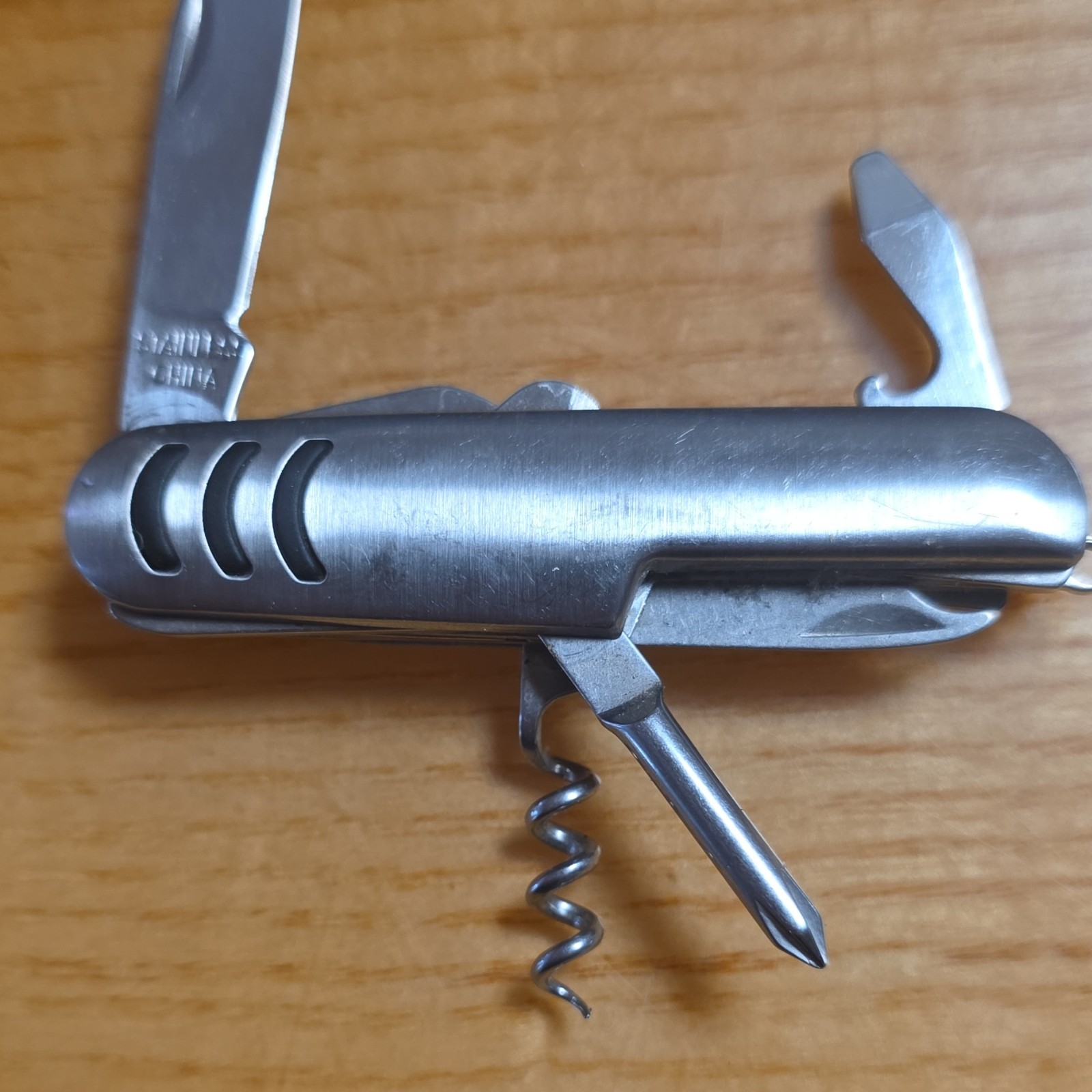 Silver Stainless Steel Multi-Tool, 5 Functions: Knife, Bottle Opener, Can Opener