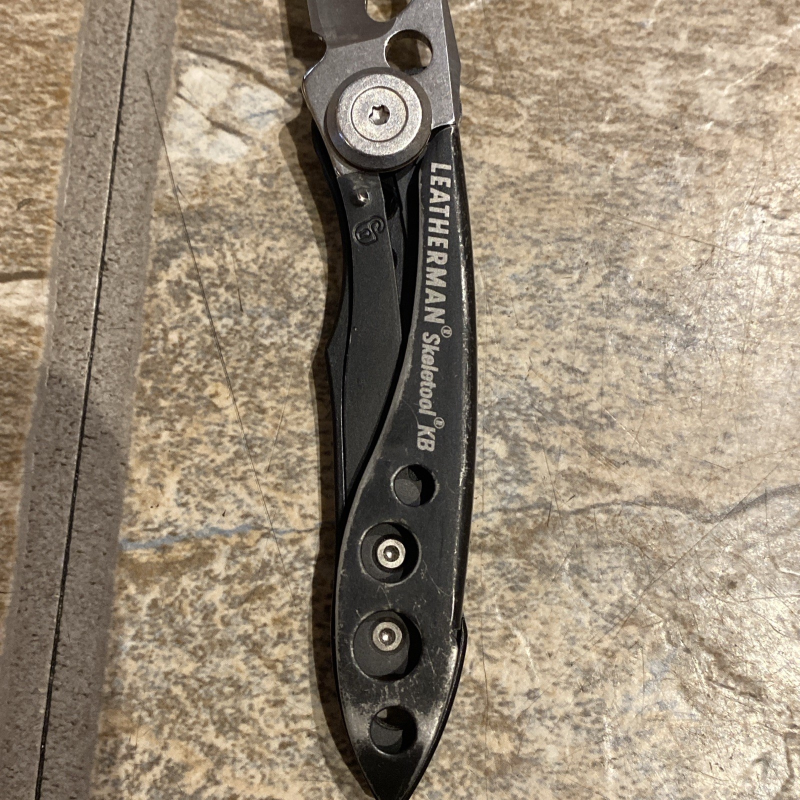 Nice! Leatherman Skeletool KB Folding Knife USA Black Handles With Bottle Opener