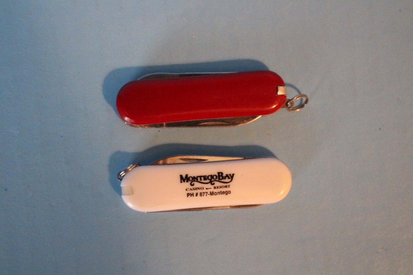 2 MULTI PURPOSE KNIFE LOT CAMPING HUNTING MULTI TOOL ONE RED ONE WHITE LOGO