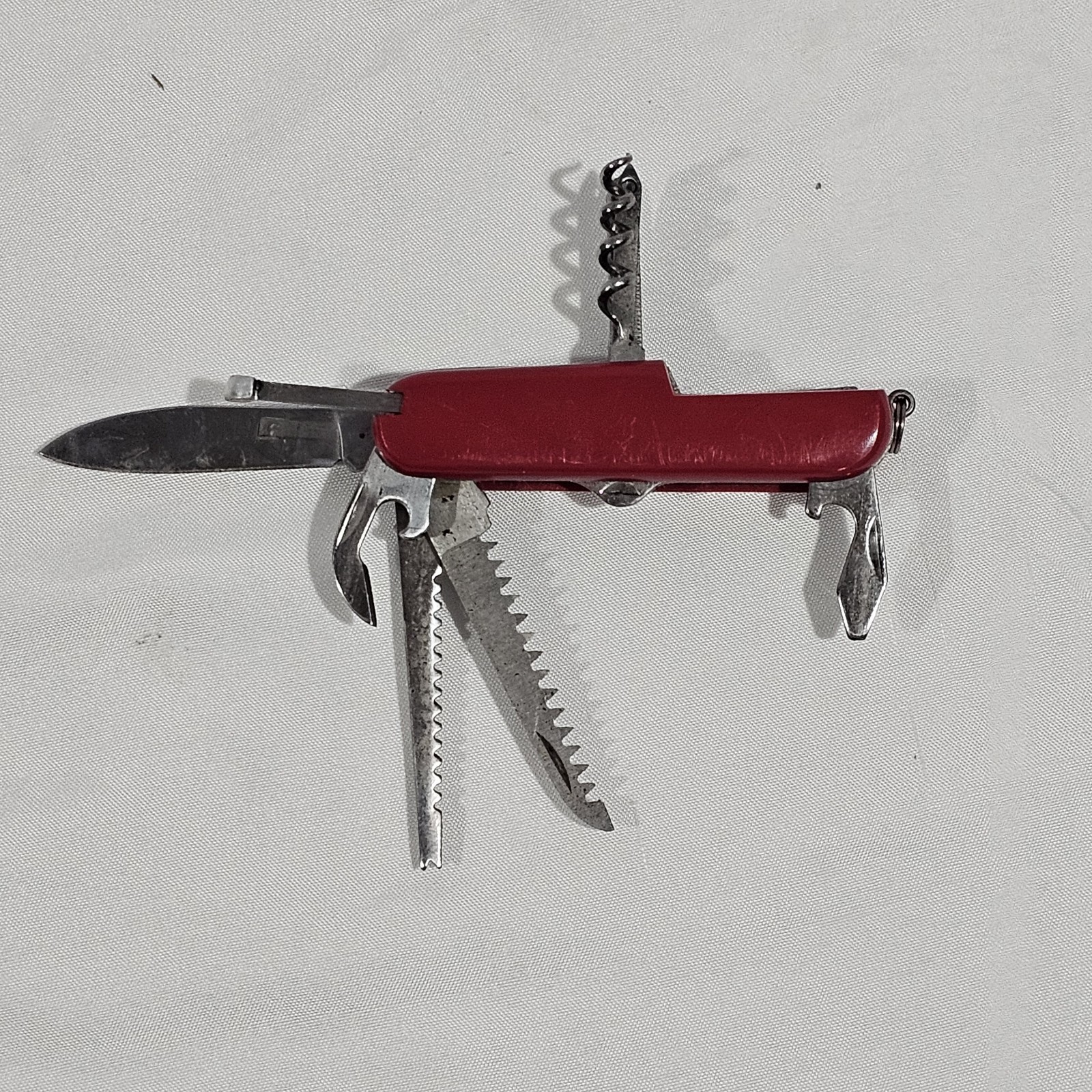 Red Multi-Tool Knife with Scissors, Serrated Knife, Corkscrew, Bottle Opener
