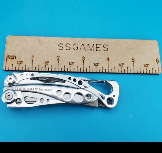 LEATHERMAN Skeletool Multi Tool – Combo Edge Blade Knife Pliers Carabiner!