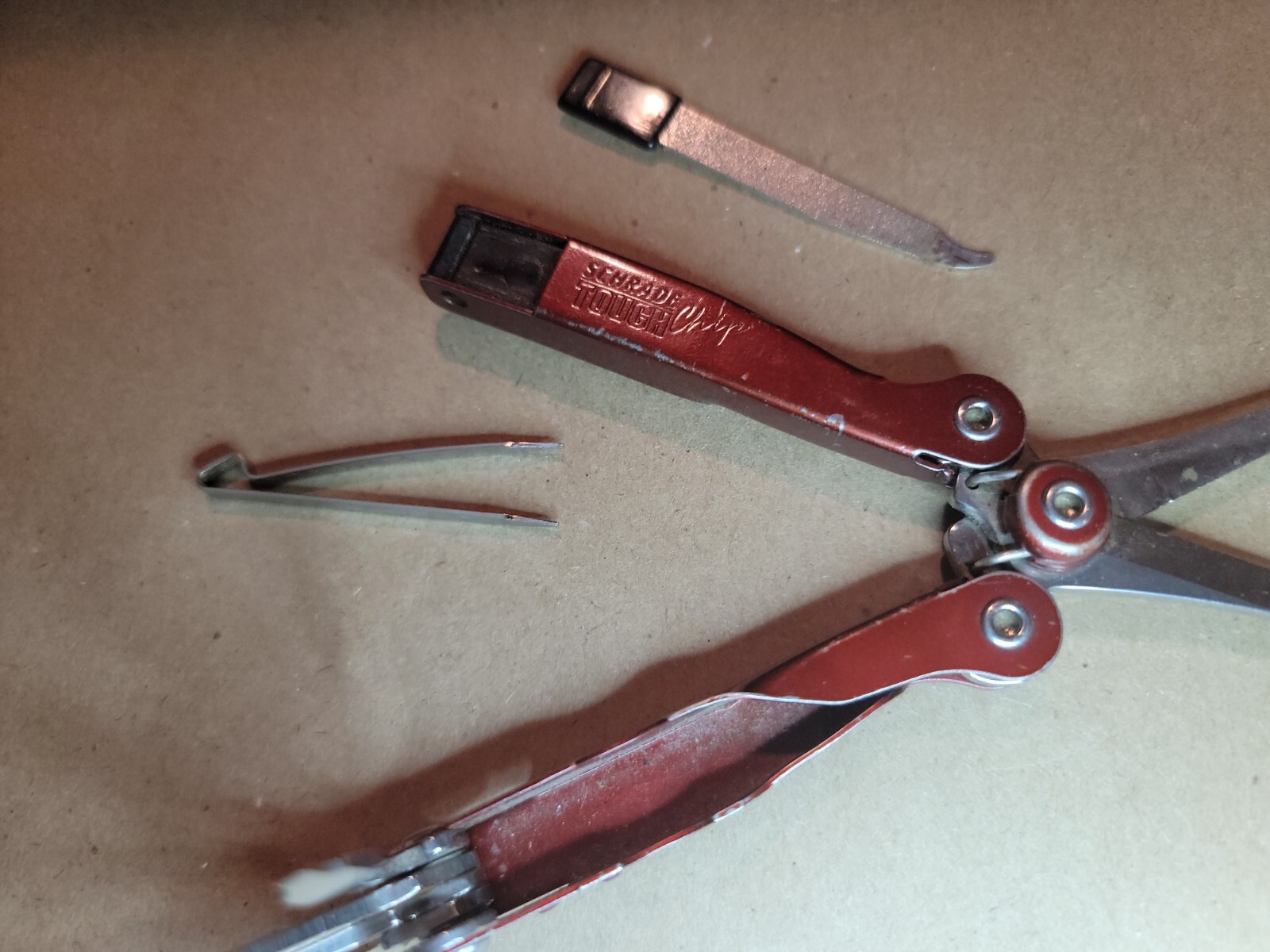 Red Schrade Tough Chip 10 In 1 Compact Multi Tool Screwdriver