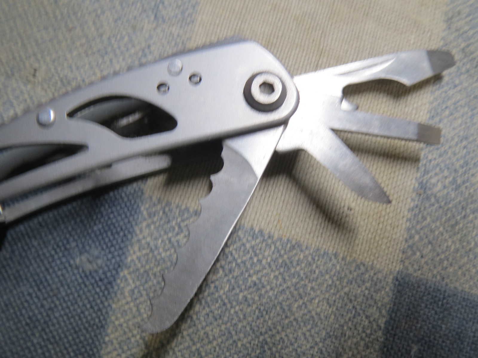 Used Small Stainless Multi-Tool 2 13/16 inch folded length