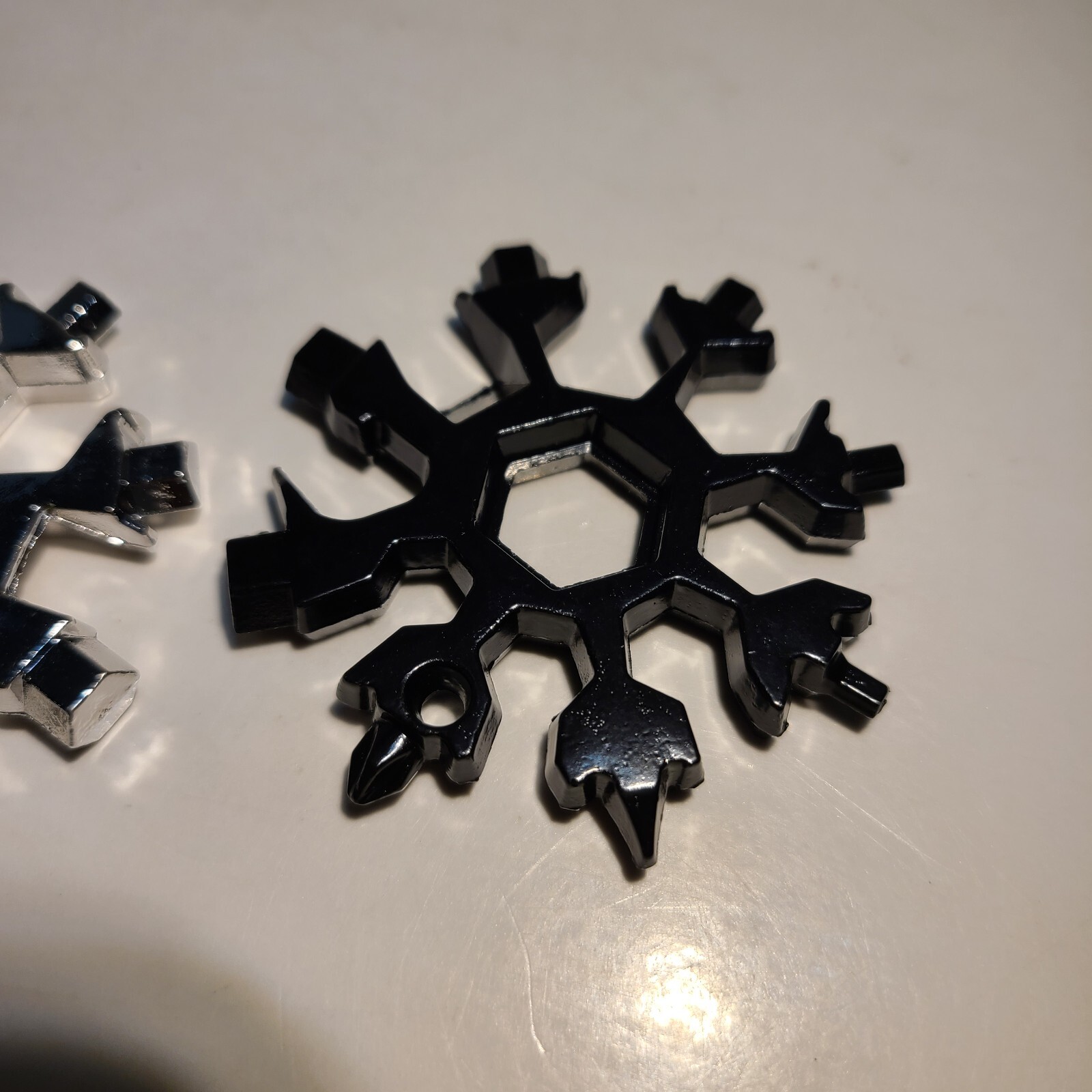 18-in-1 Stainless Steel Snowflake Multi-Repair Tool with Bottle Opener, etc.
