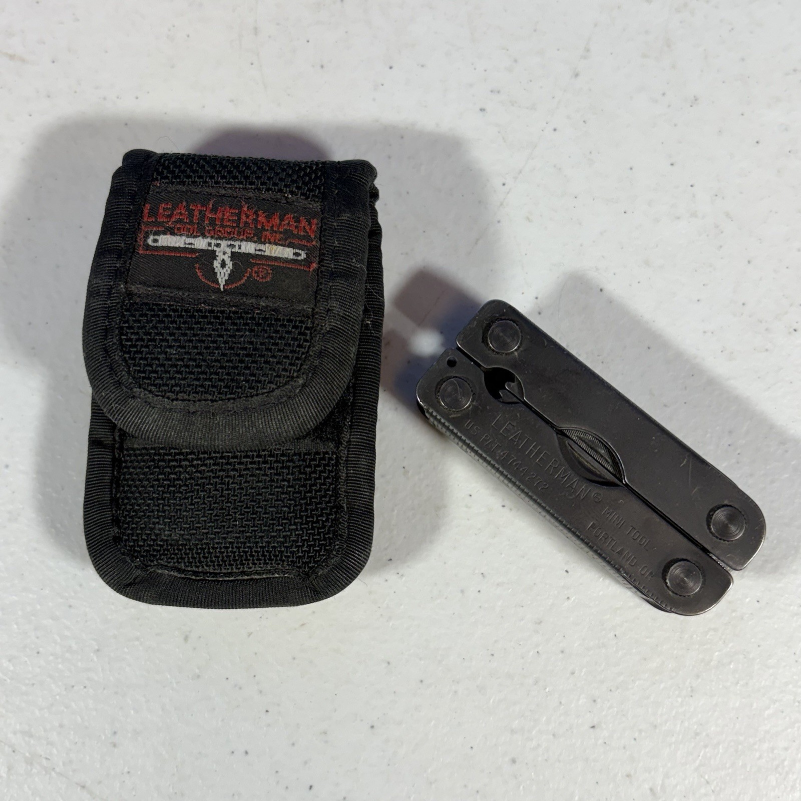 Leatherman Black MINI TOOL Black Multi Tool W/ Sheath