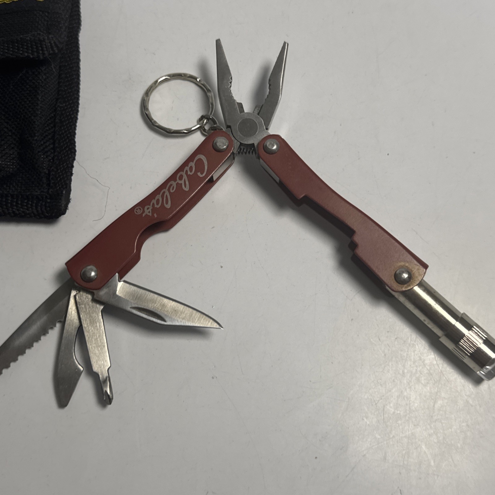 Cabelas Pocket Multi-Tool Flashlight Serrated Knife Can Opener Key chain Pliers