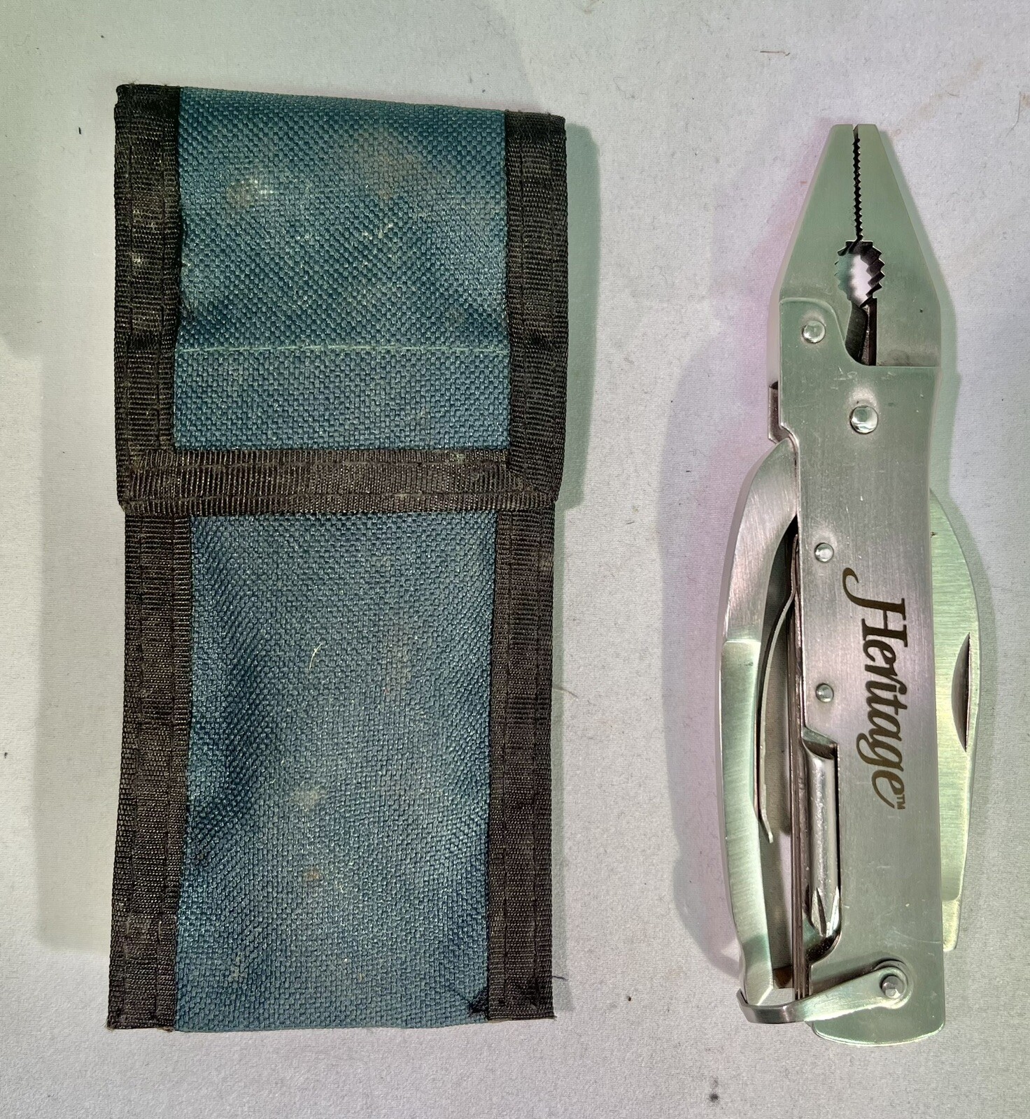 Unique Heritage Multitool W/case (Pliers, Blade, Opener, Saw, Wire Cutter)