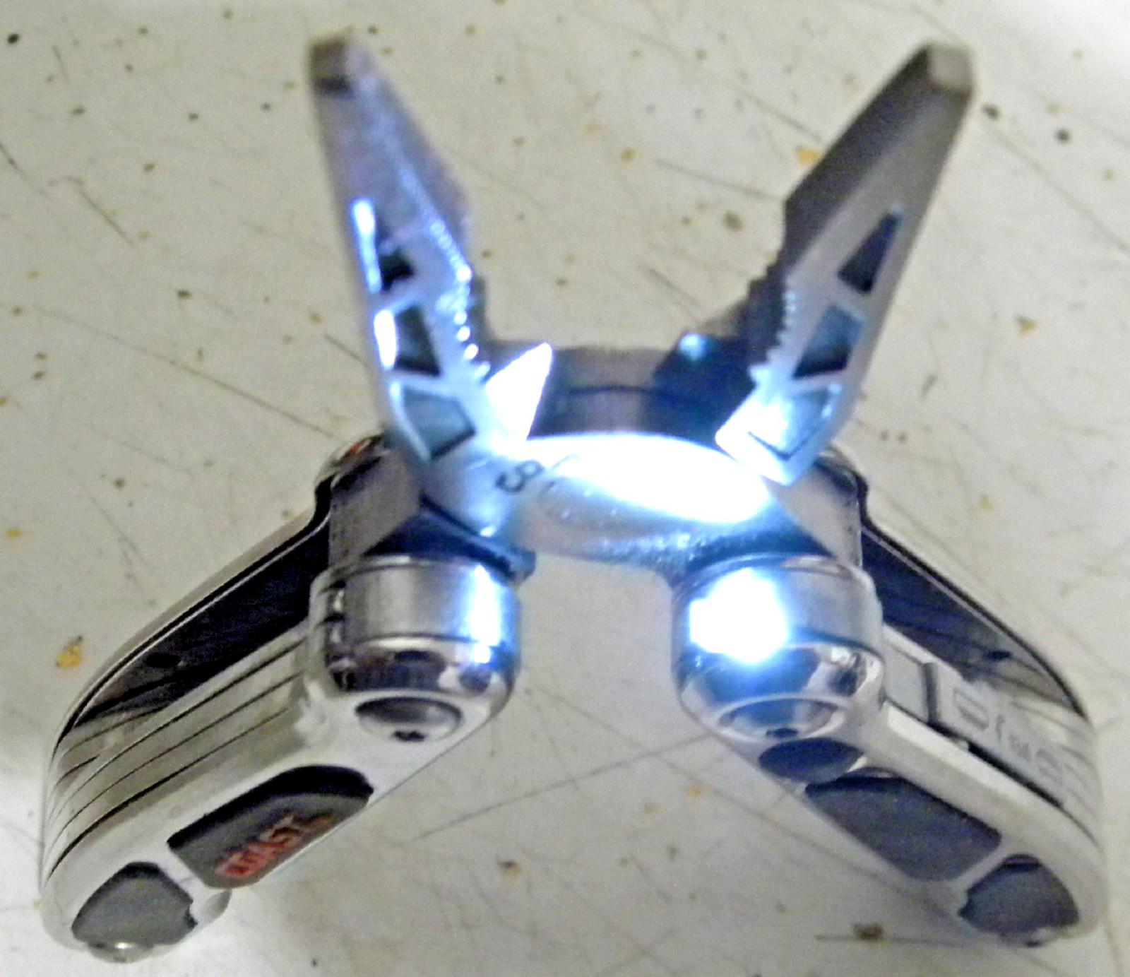 COAST Mini Multi Tool Silver and Black with built in LED and a Pocket knife