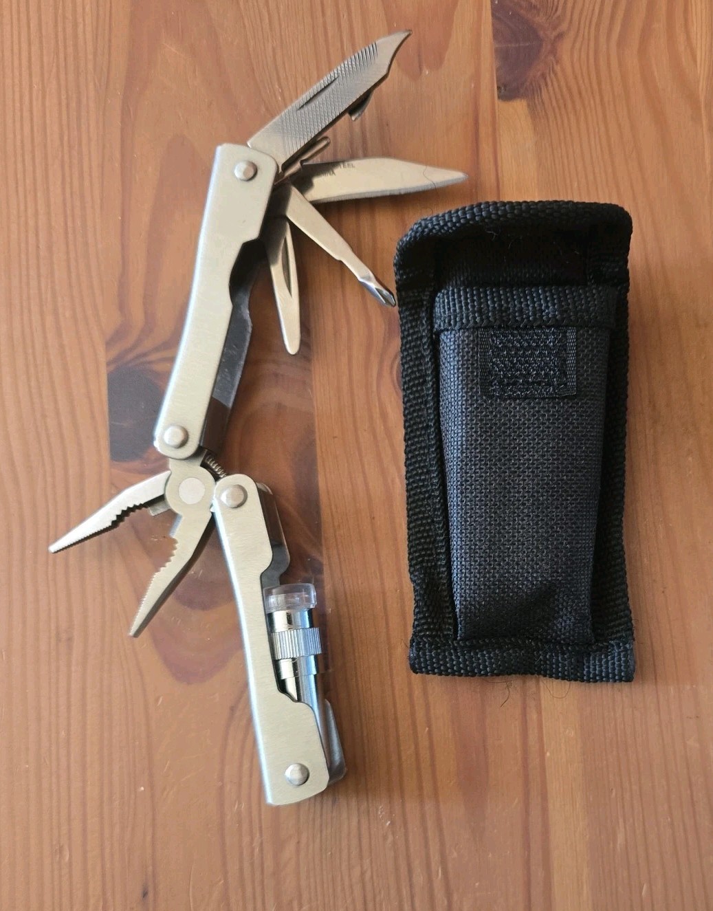 Multi Tool With Knife Screw Driver Phillip Flat Snips file And Flashlight