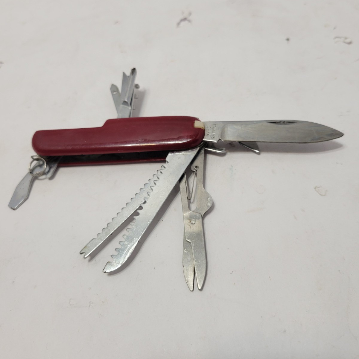 Red Multi-Tool Knife with Scissors, Serrated Knife, Corkscrew, Bottle Opener