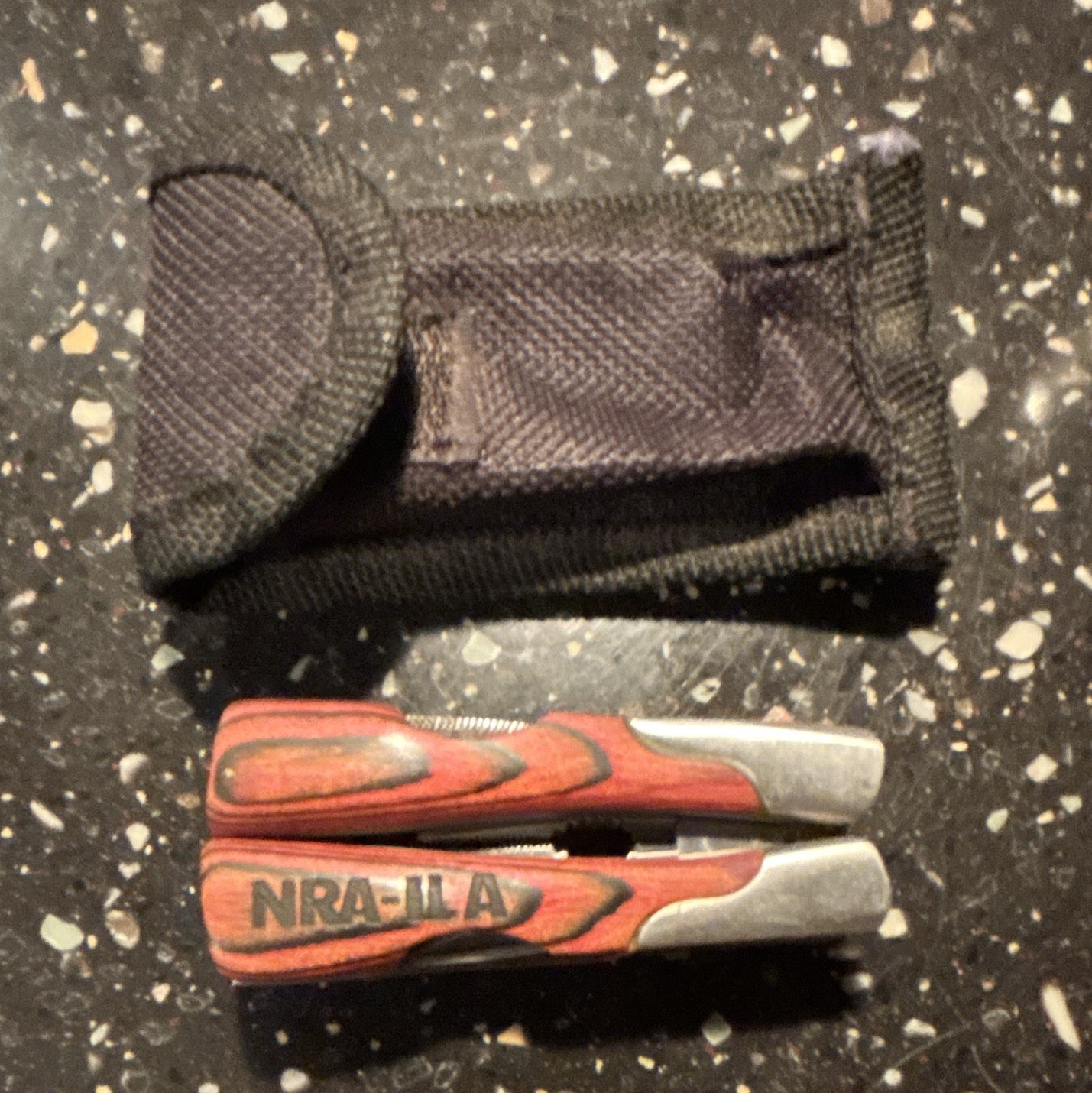 NRA II-A 11-in-1 Folding Multi-Tool Pliers 2″ Straight Blade Red/Black Sheath