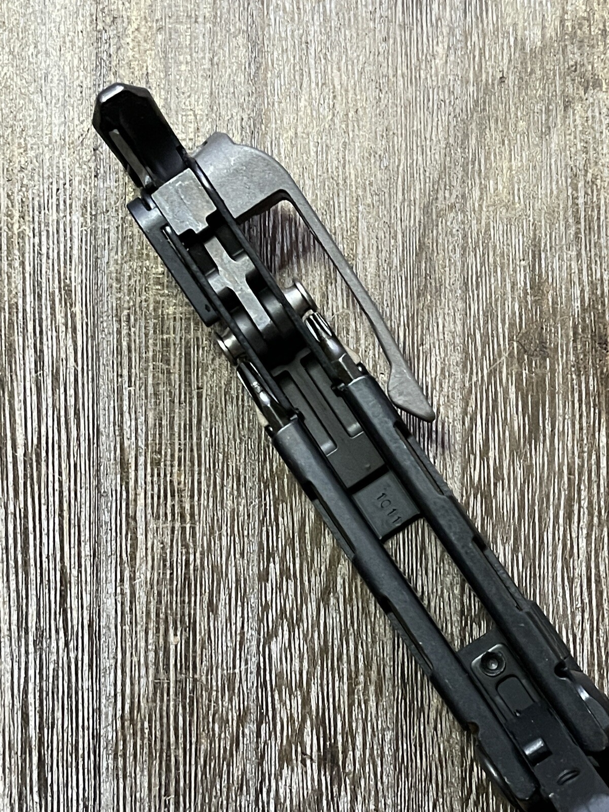 Leatherman MUT Black w/Titanium Clip multi tool, brown sheath. Made 10/2011
