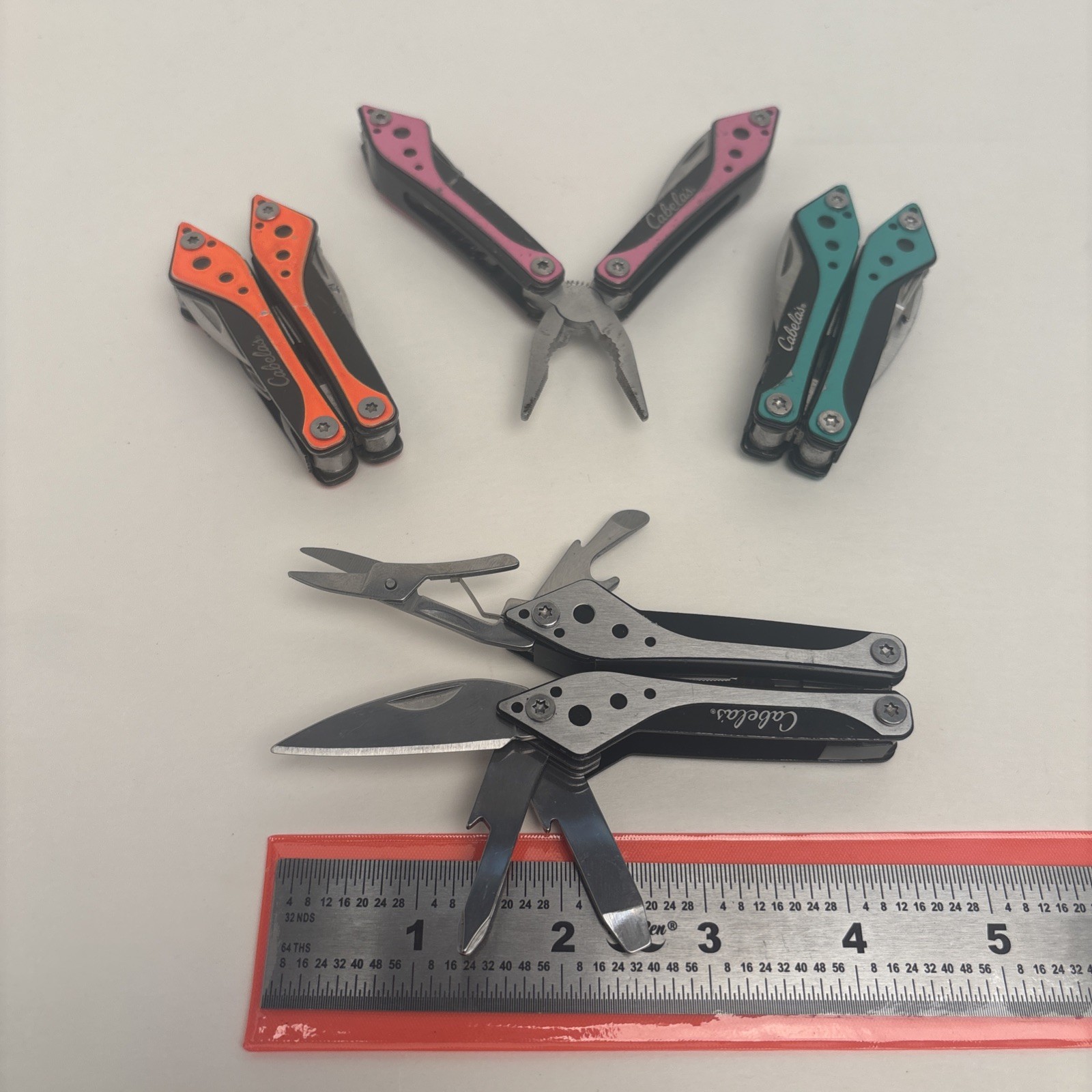 Cabela’s LOT of 4, Orange Teal Silver Pink Small Multi-Tool Camp Hike Hunt Fish
