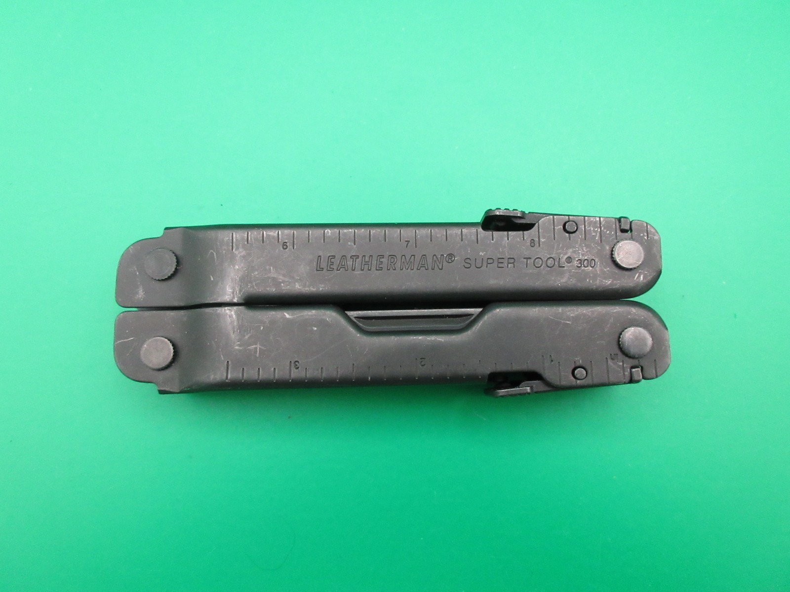 Leatherman Super Tool 300 Black Oxide Folding Multi Tool Knife Saw #60A