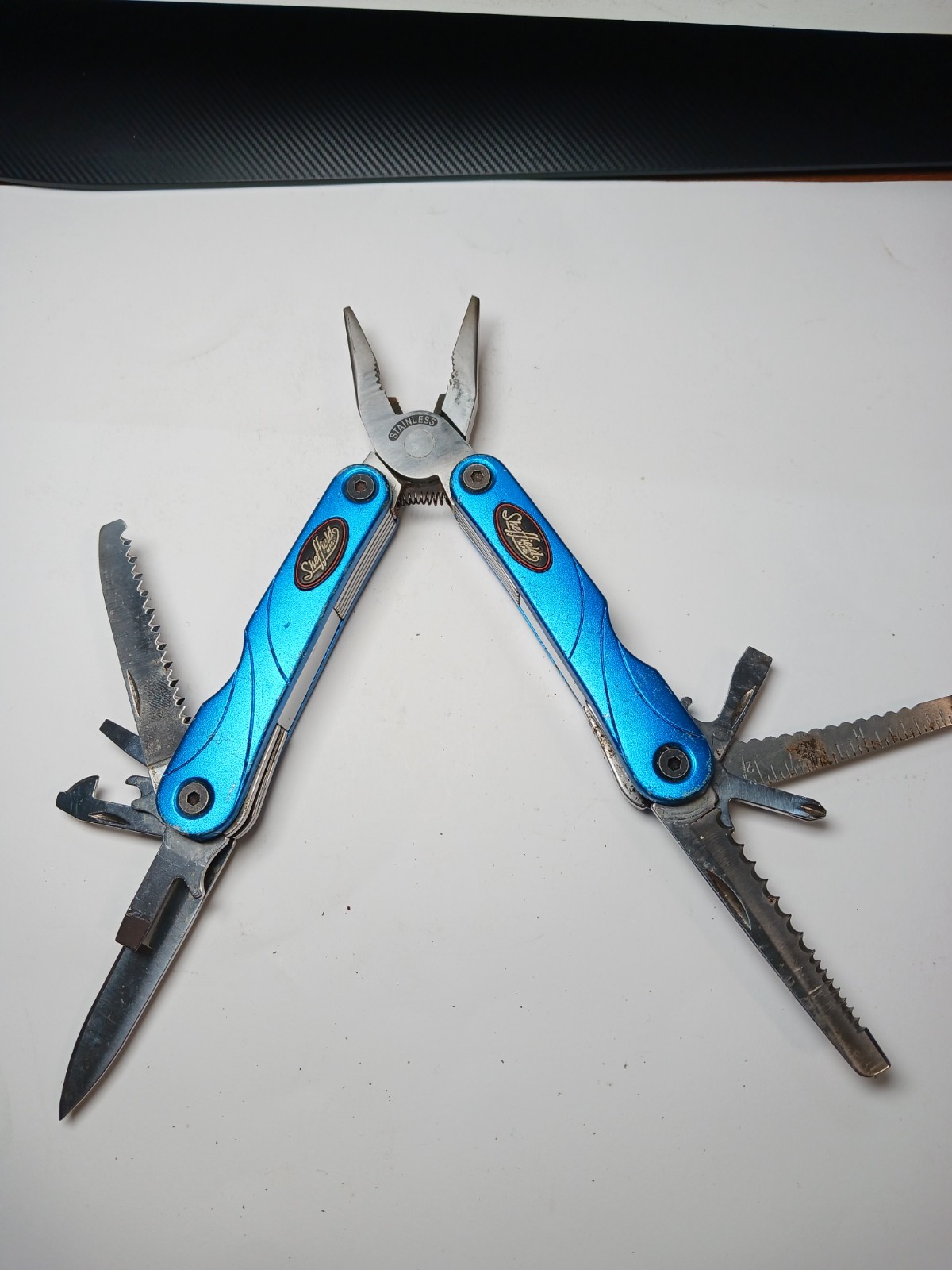 Sheffield Multitool Blue Handle Pliers Saw Knife Screwdrivers – Used